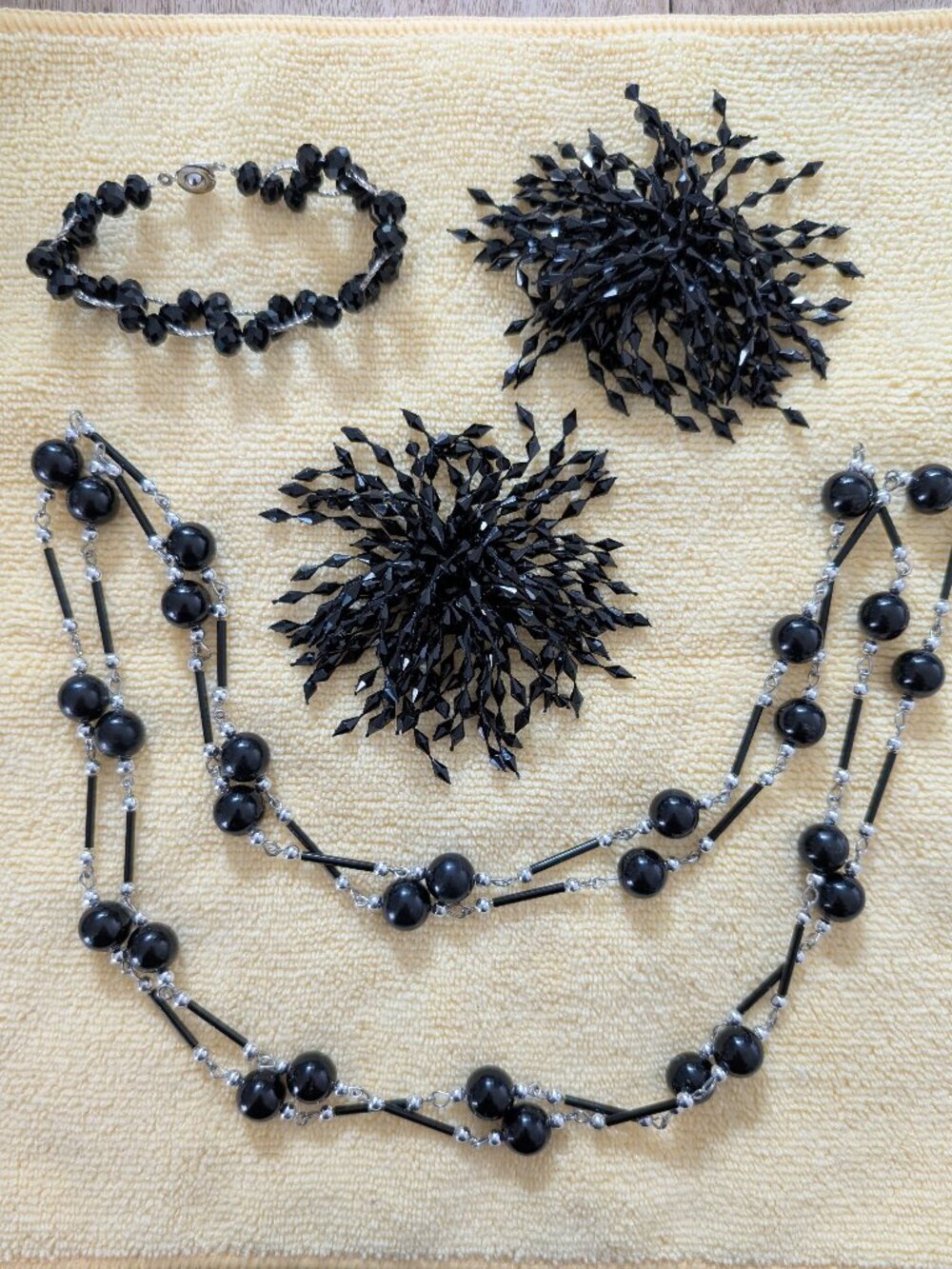 Black necklace, bracelet and clip earings
